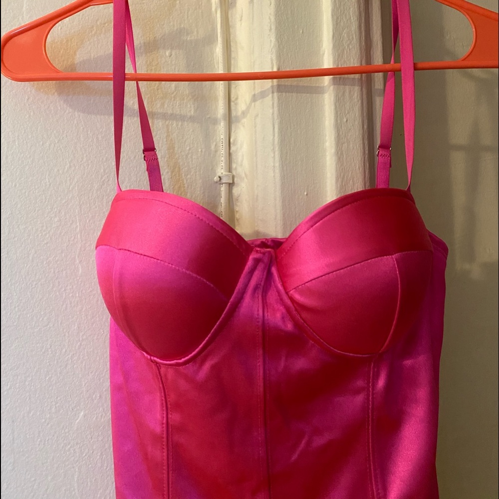 Bright pink body con balcony dress